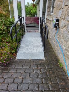 Modular ramp installed at a glass side door