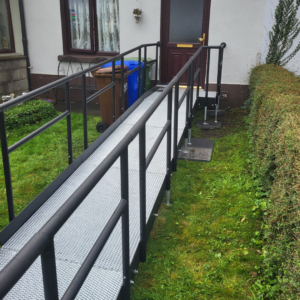 A metal modular ramp at a front door