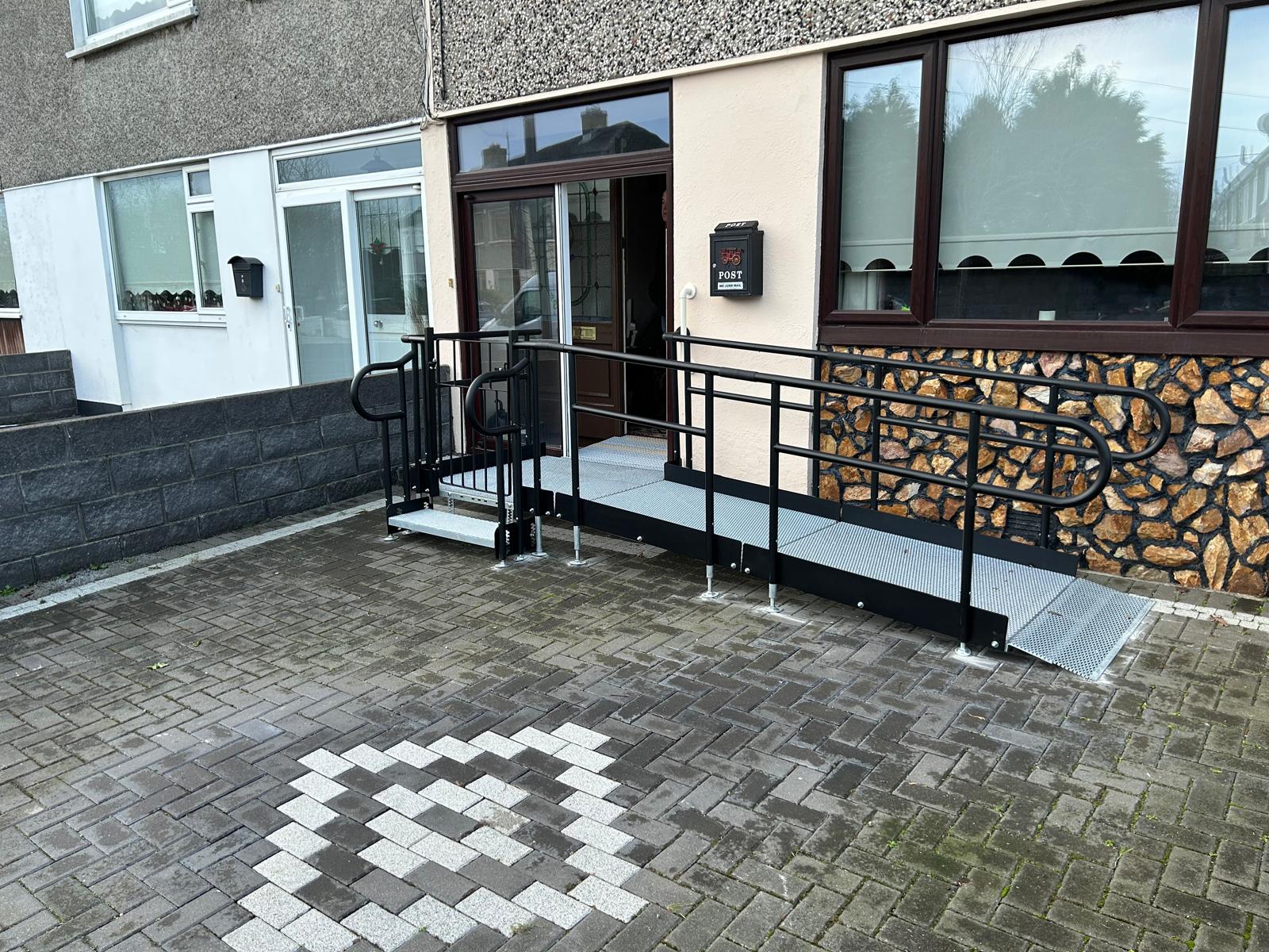 Modular access wheelchair ramps installed at the front of a house