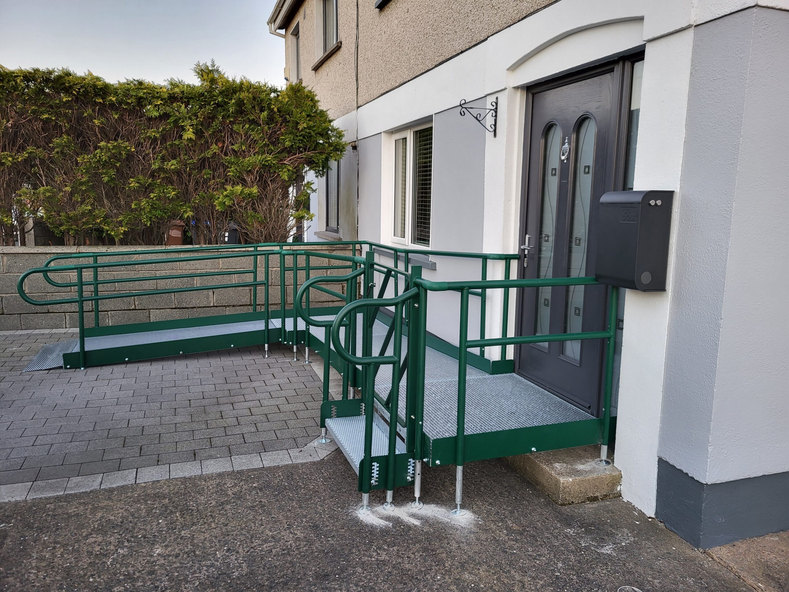 Wheelchair ramp supplier - Modular ramp at front of house